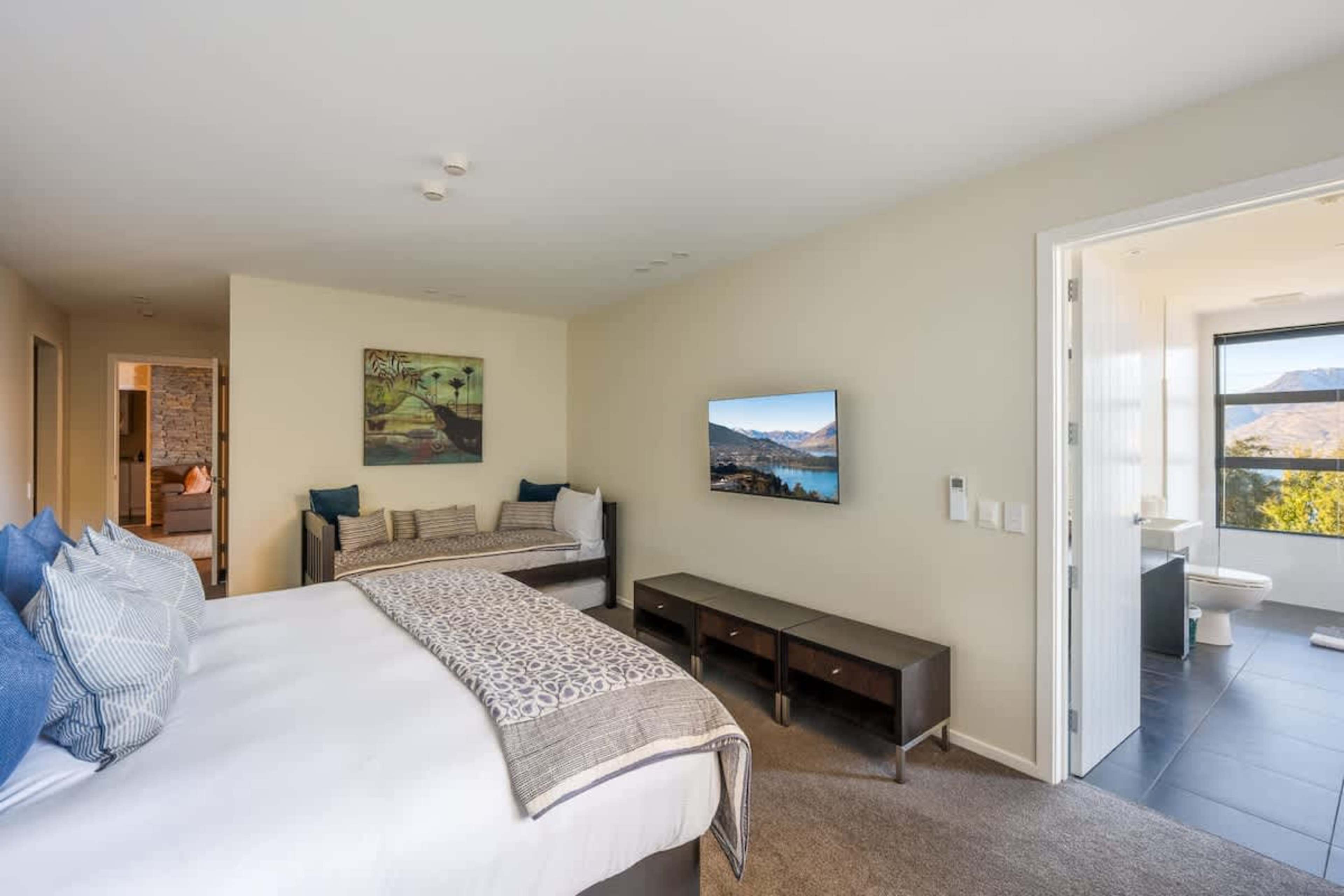 The spacious second bedroom offers both comfort and adaptability with its king split bed. Wake up refreshed and ready to explore all that Queenstown has to offer.