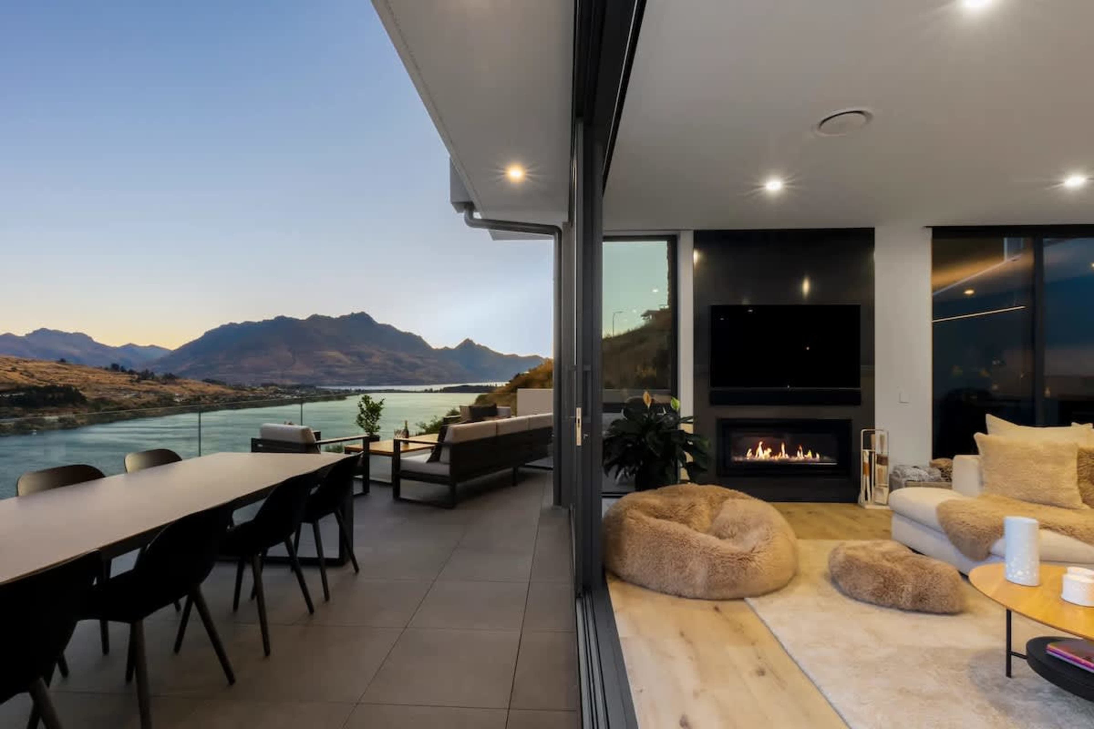 Step outside to your private balcony where lake and mountain views stretch endlessly before you. Light the outdoor fireplace or slip into the hot tub as the sun sets over Queenstown.
