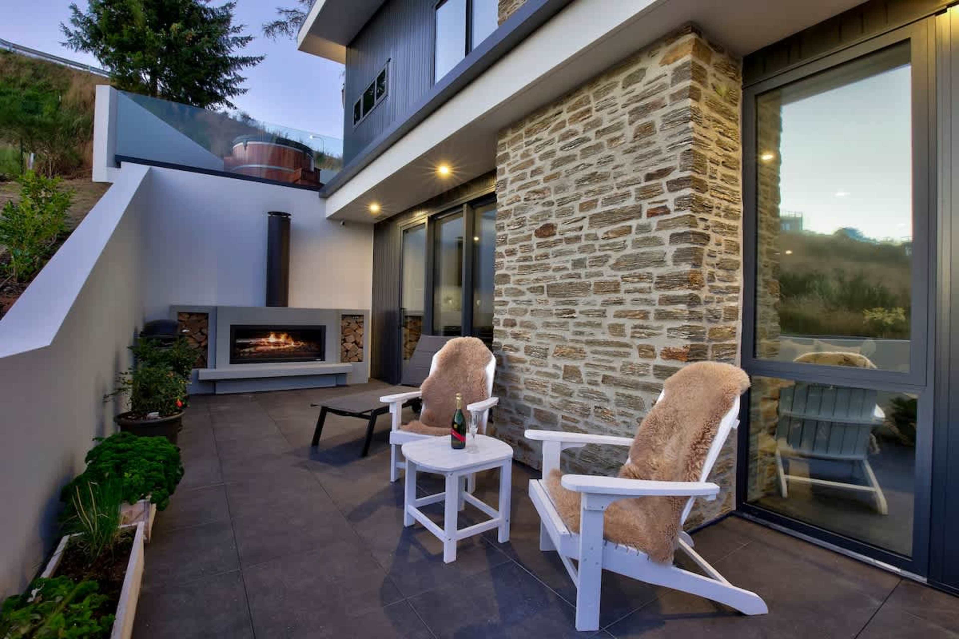After a day exploring Queenstown, sink into soft seating by the fire. The glow of the flames and mountain views outside set the perfect evening mood.