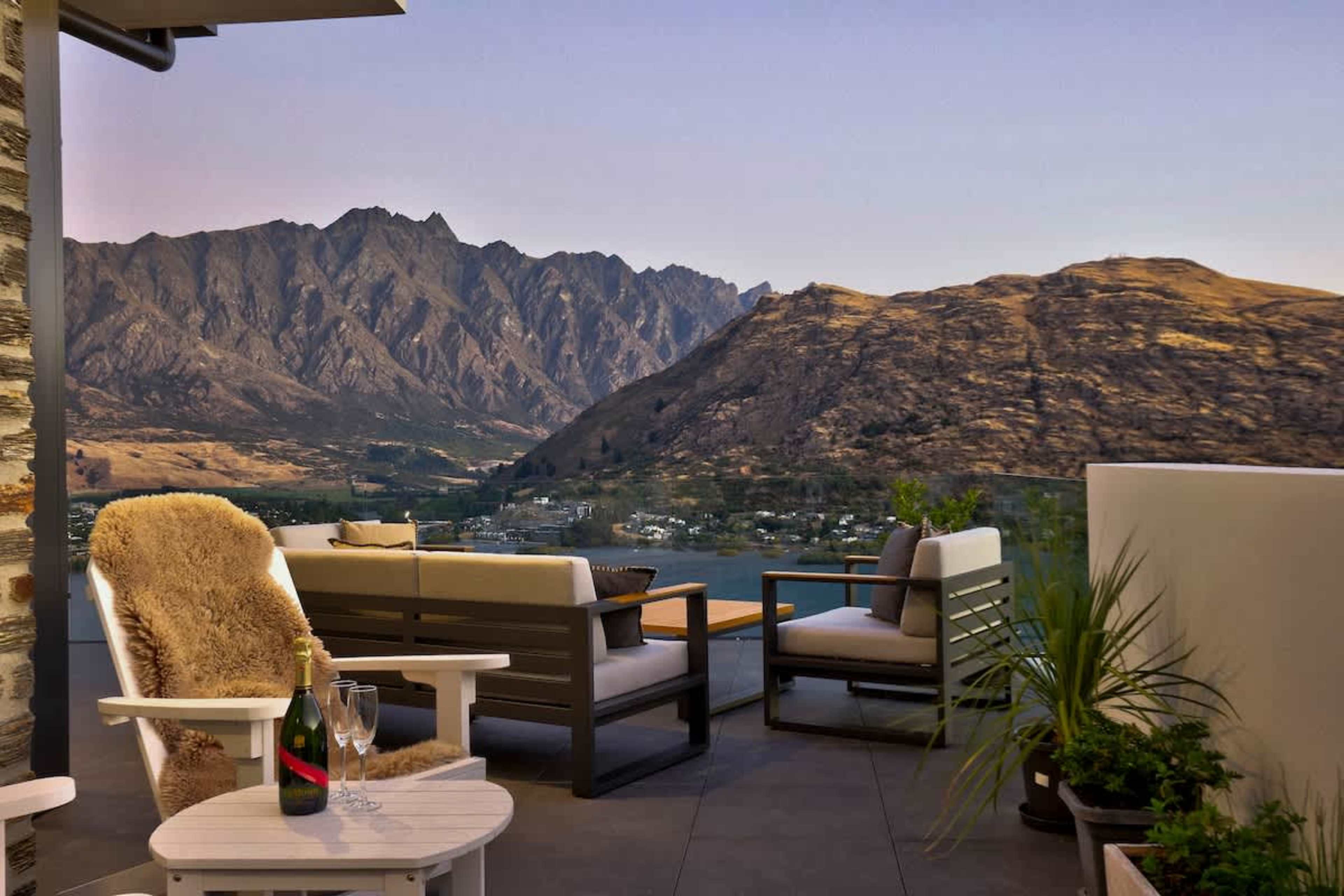 The living room flows seamlessly to the terrace, blurring the line between indoors and out. Here, the mountains feel as much a part of the home as the walls themselves.