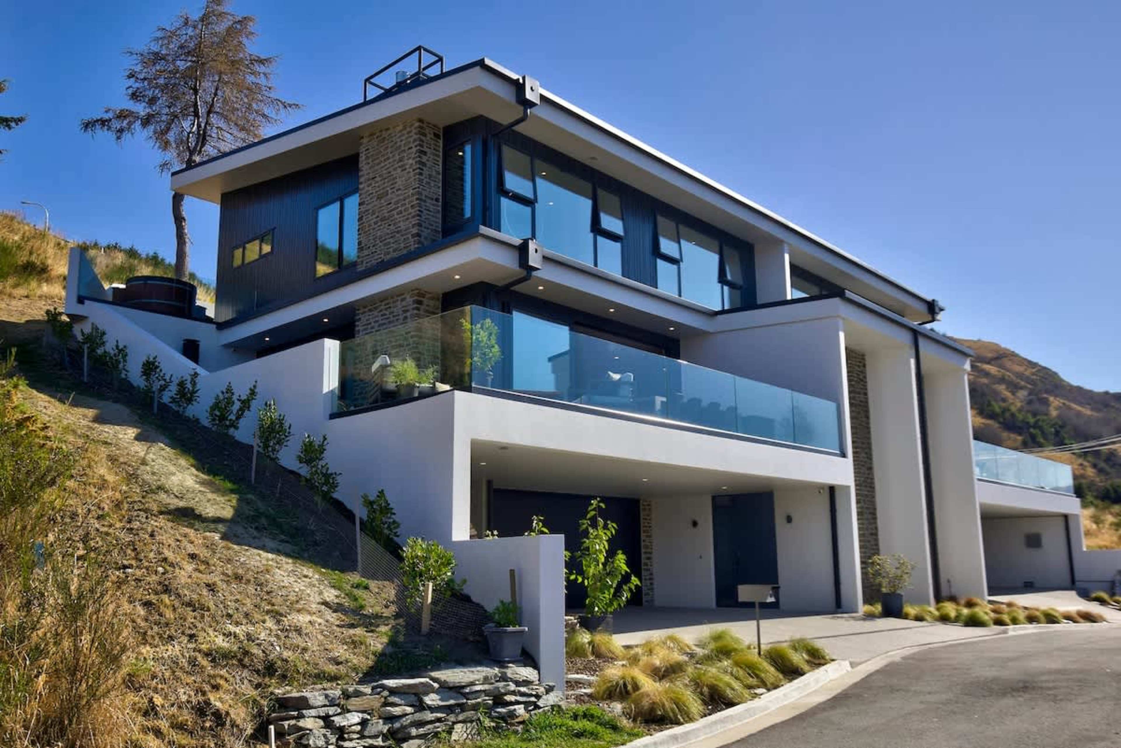 Perched high on Queenstown Hill, this villa blends contemporary architecture with alpine beauty. You’ll know you’ve arrived somewhere special.
