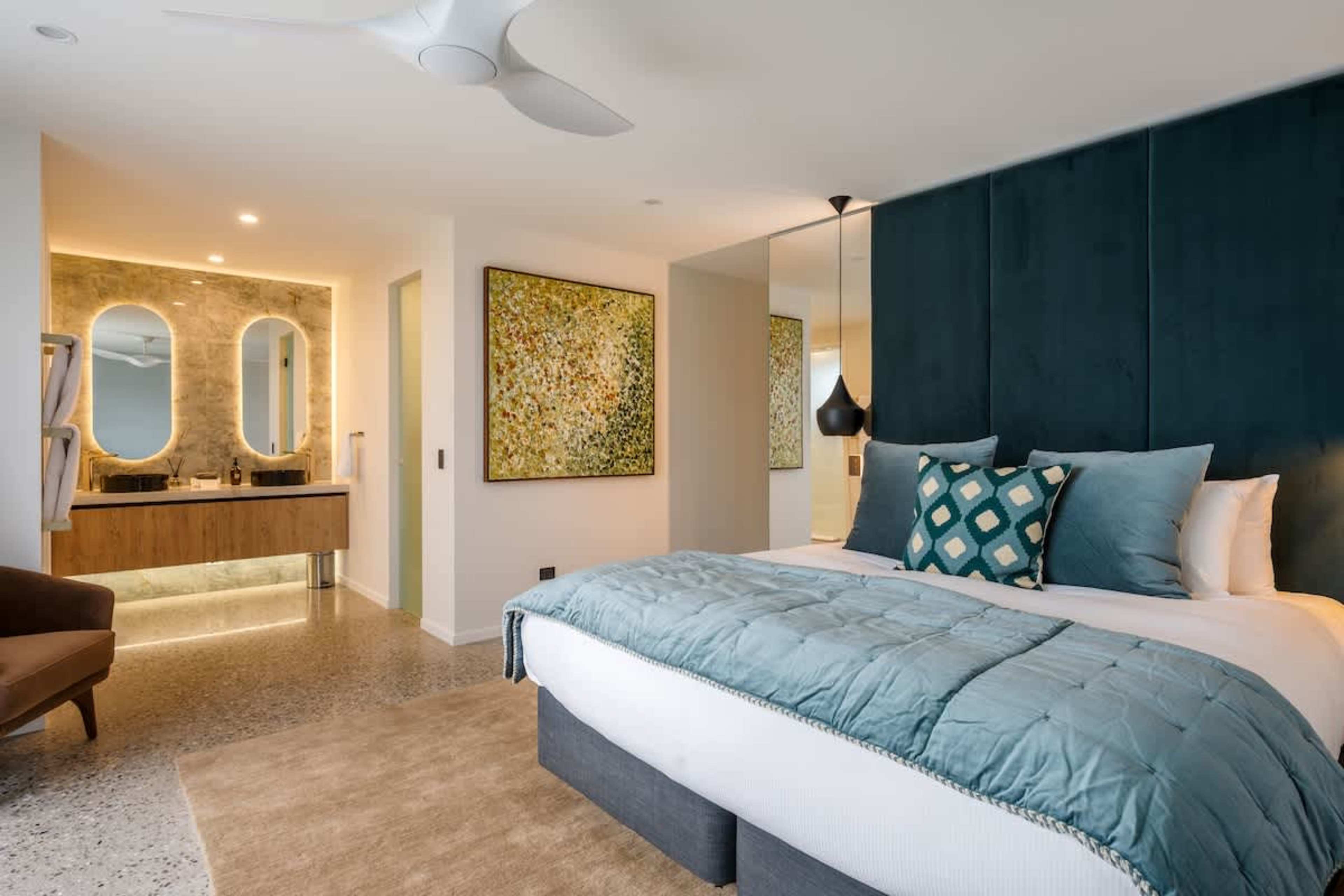 The master ensuite features his and hers showers and basins, offering ultimate convenience and privacy. With underfloor heating, every step is warm and luxurious, creating a true spa-like experience.