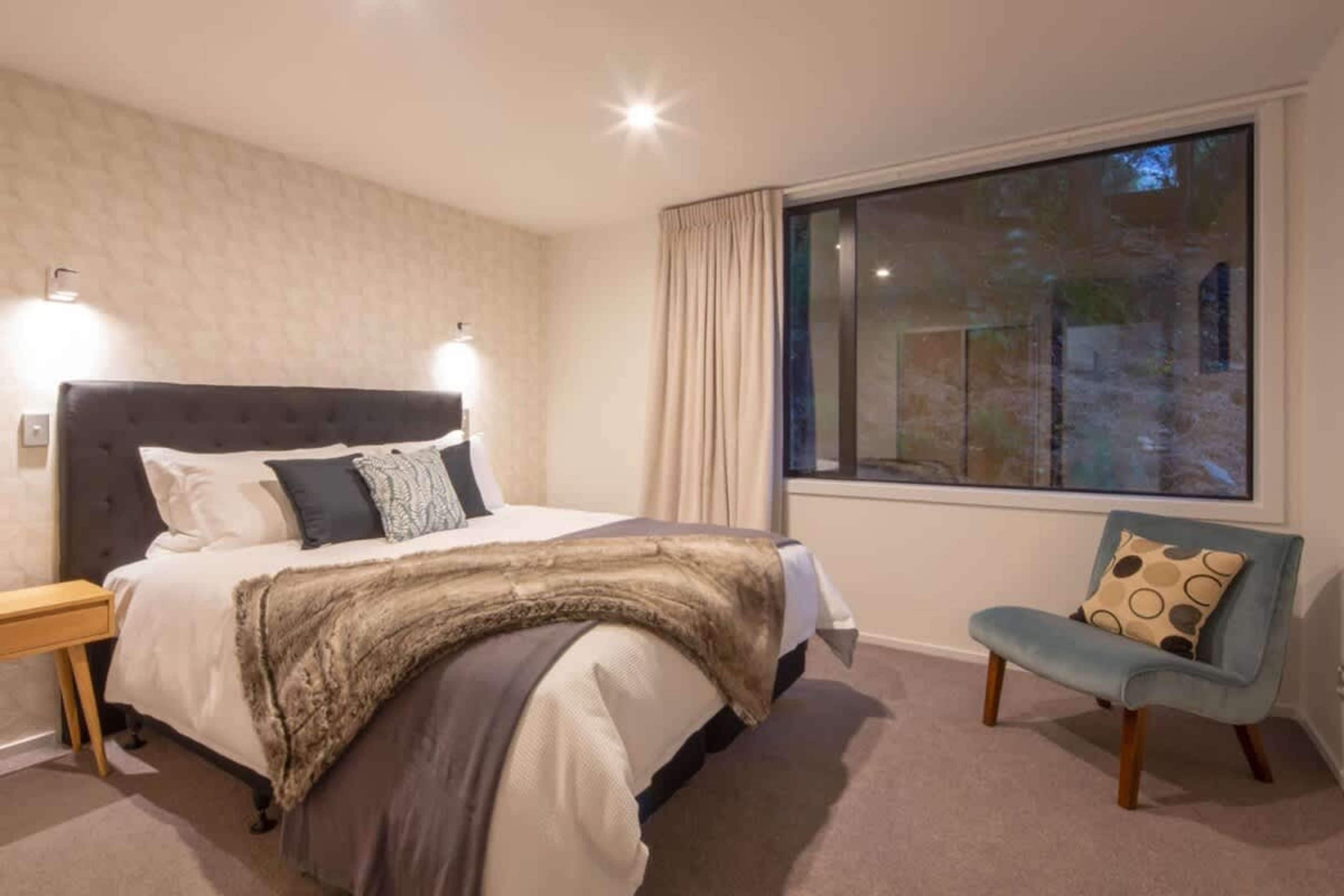 Elegant Bedroom 1 with Super King Bed and Luxury Linens – Rest in style in this beautifully appointed bedroom, featuring a plush super king bed with premium linens, offering the ultimate comfort for a peaceful and rejuvenating sleep.