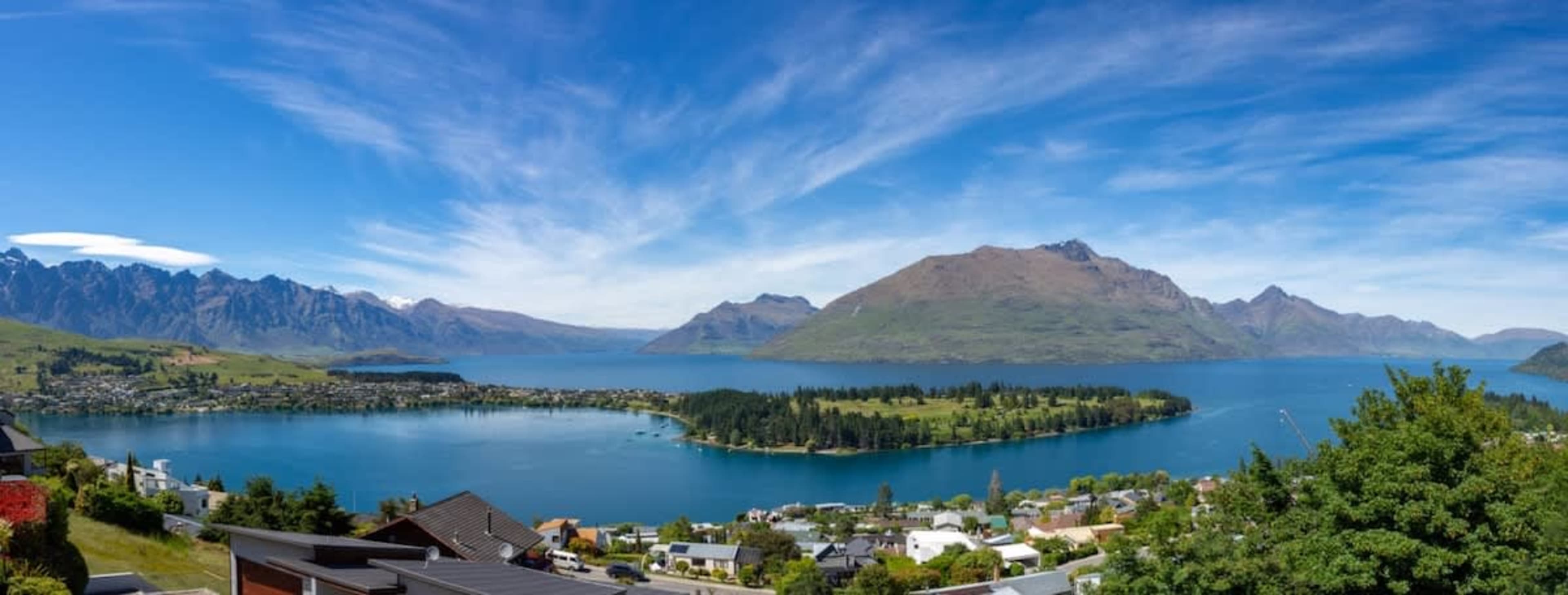 Balcony with Breathtaking Views – Take in the stunning lake and mountain vistas from this spacious balcony, complete with a BBQ and comfortable seating, making it the perfect spot to relax and entertain.