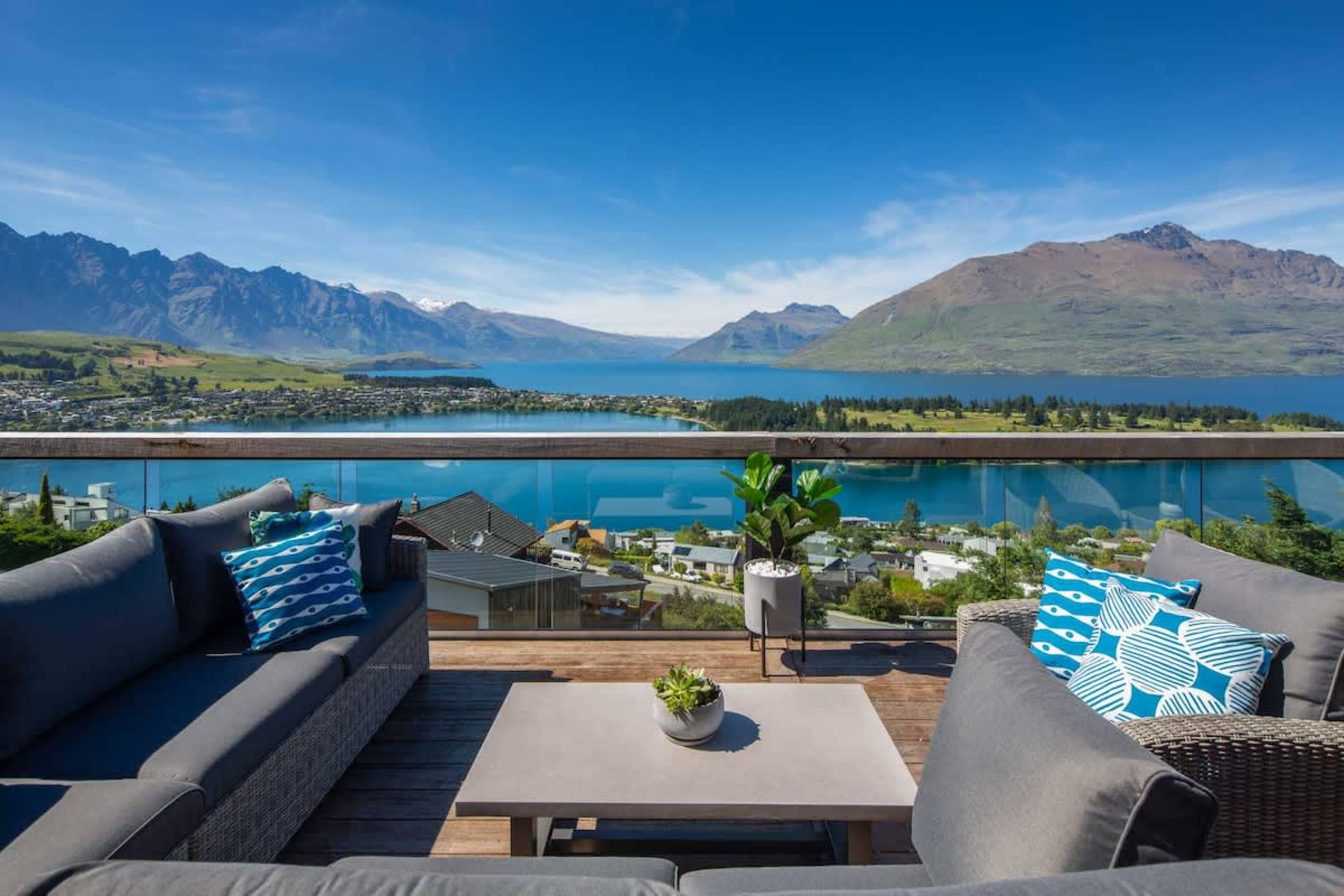 Outdoor Dining with Panoramic Views
This balcony offers a dining area with breathtaking lake and mountain views. Complete with a BBQ and cozy seating, it's ideal for enjoying meals outdoors or simply soaking in the serene surroundings.