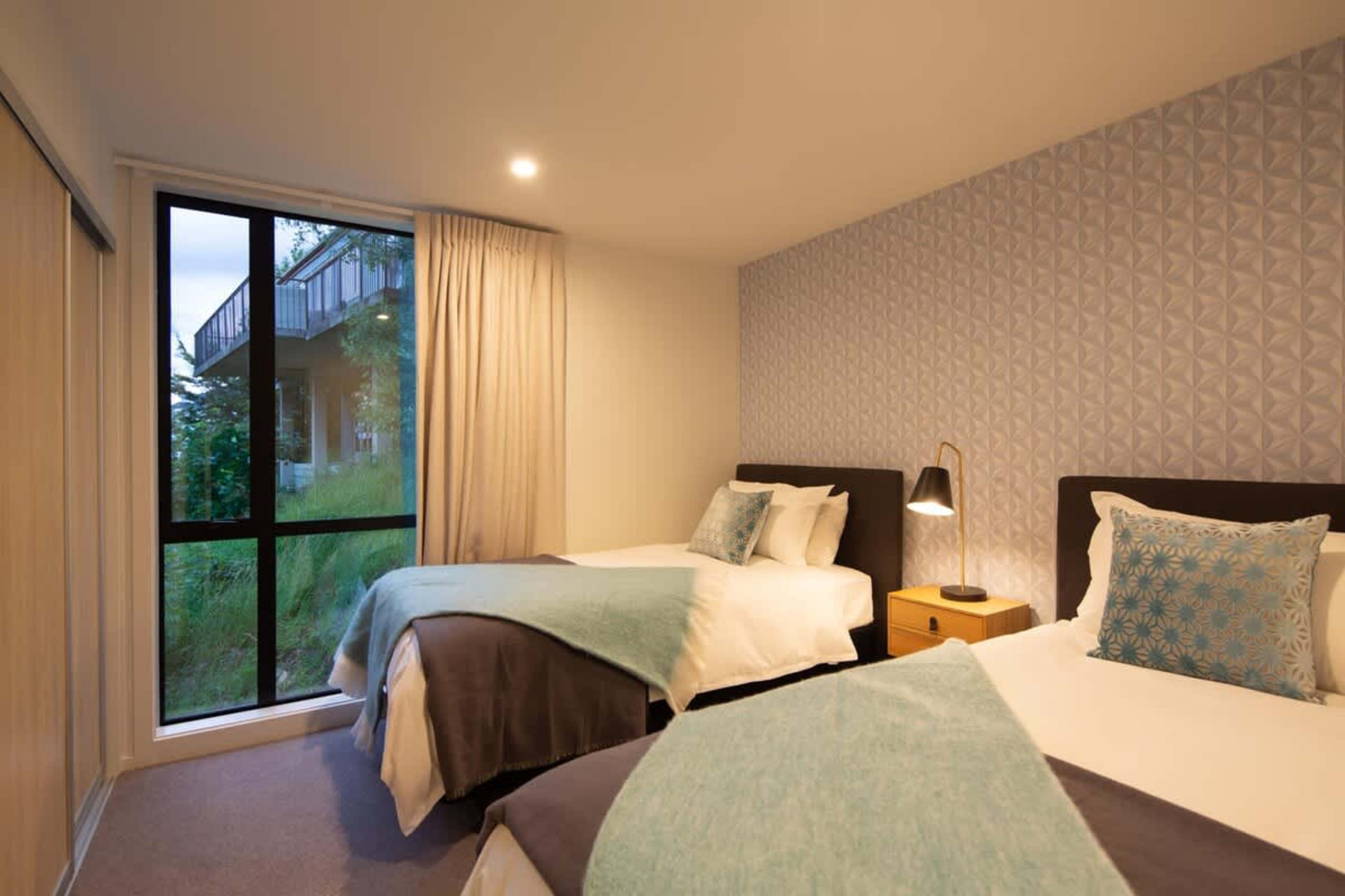 Flexible King-Split Bedroom
This versatile bedroom features a king-split bed, offering flexibility for your stay. With modern furnishings and ample storage, it provides a comfortable and restful space, perfect for couples or friends.
