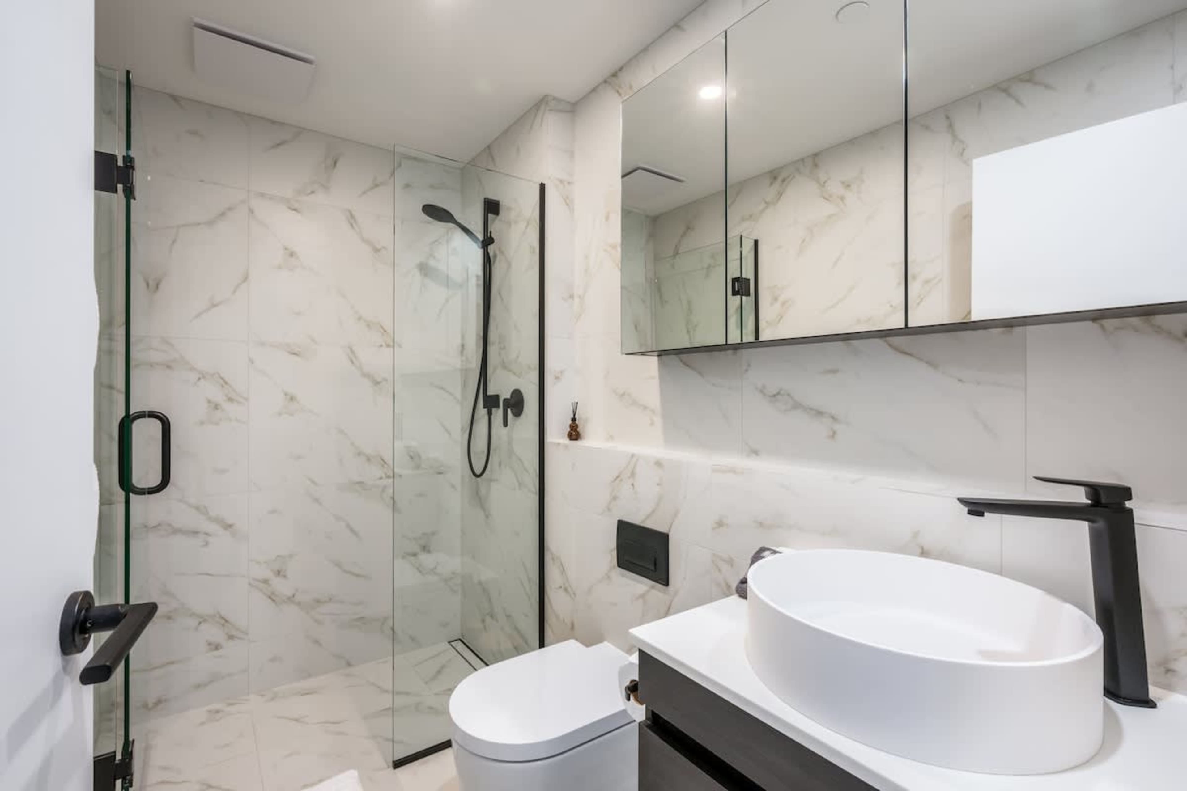Luxury main bathroom, Clubhouse Lane apartments, Jacks Point Golf Course. Heated floors, Ashley & Co amenities, double vanity, walk-in rainfall shower, modern alpine design. Queenstown golf & ski retreat.