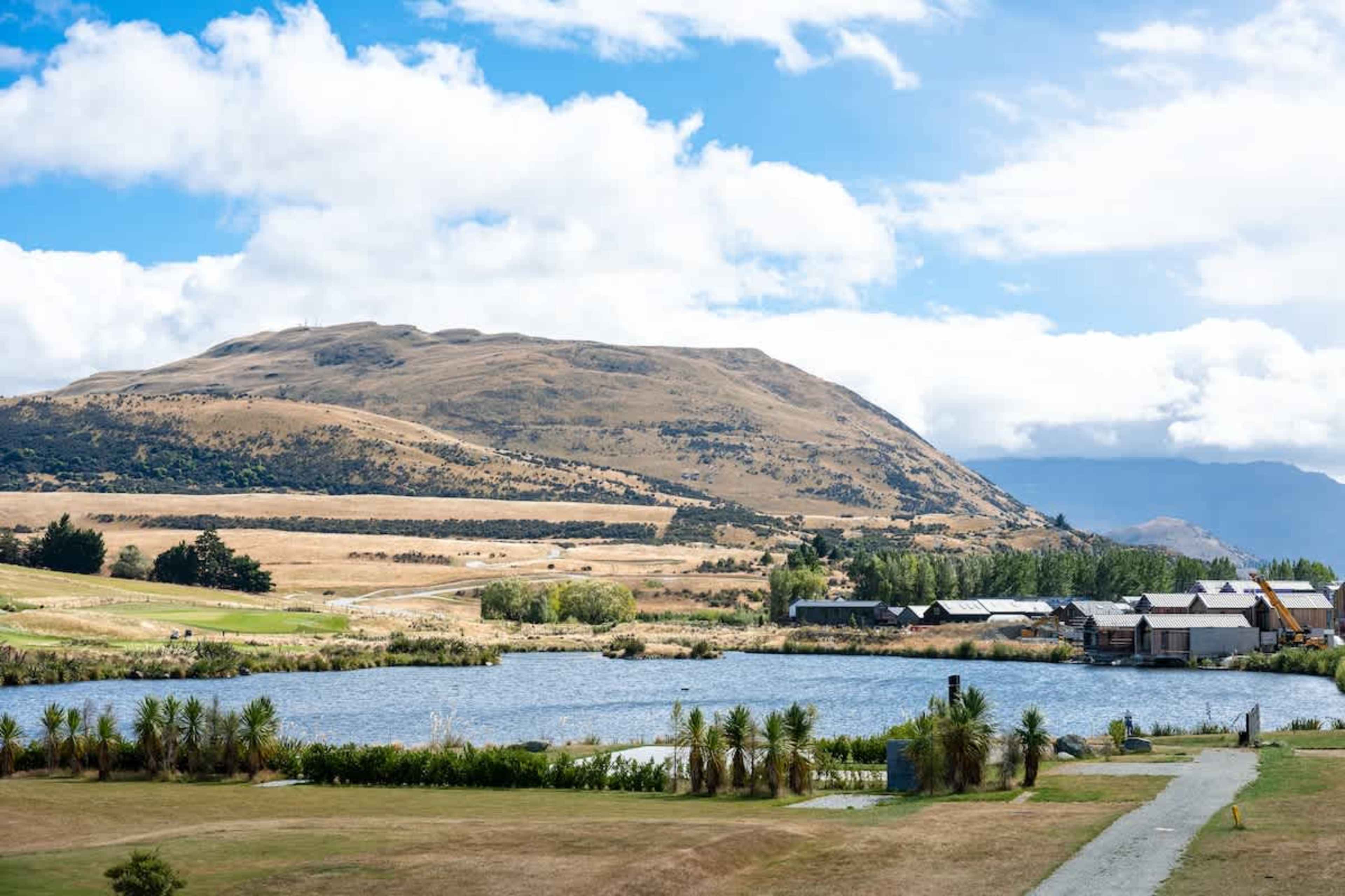 Luxury apartment exterior, Clubhouse Lane, Jacks Point. Sophisticated alpine style set on the golf course with sweeping mountain & lake views. Queenstown’s premier golf & skiing location.