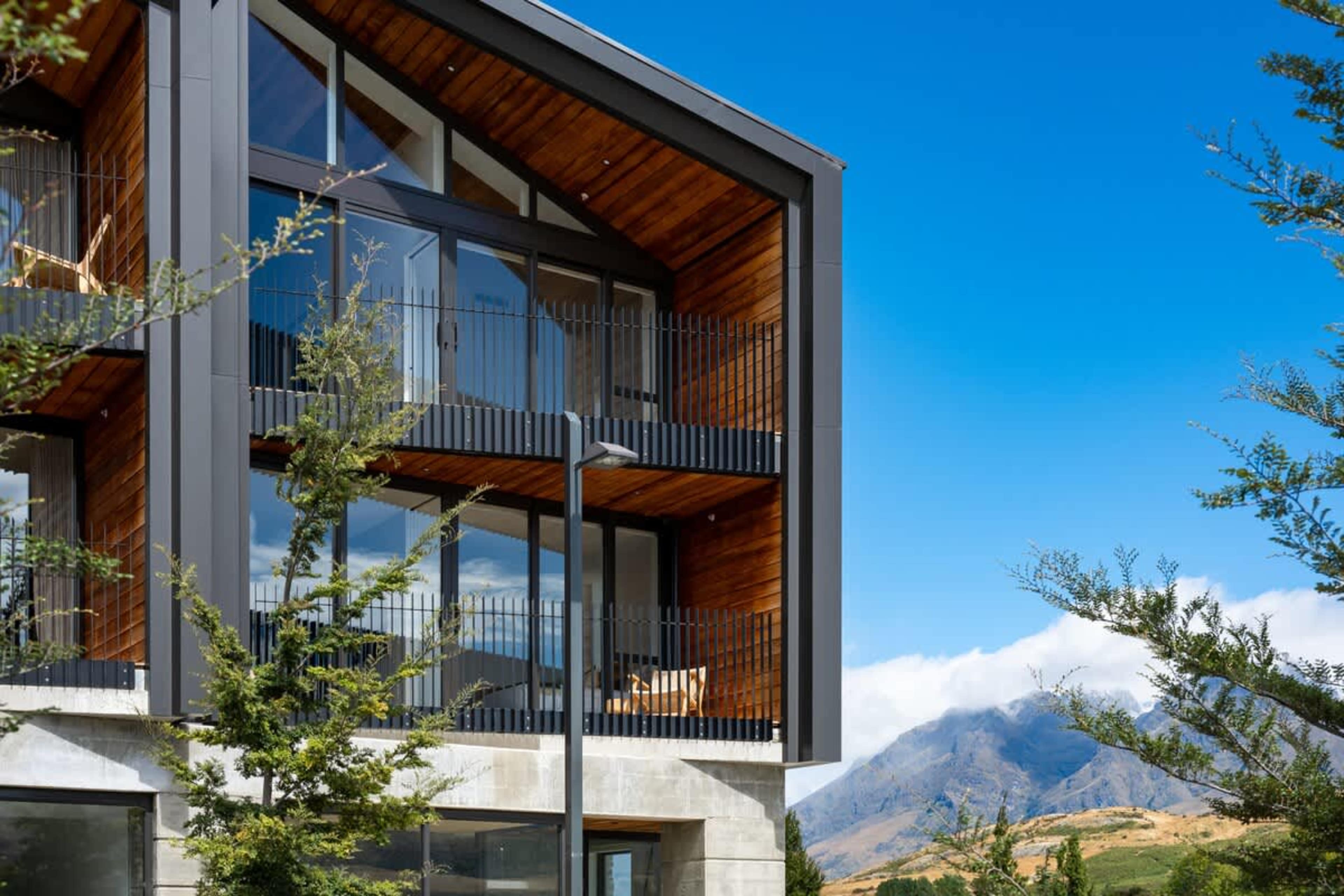 Clubhouse Lane luxury apartments, Jacks Point Golf Course. Beautiful contemporary alpine facade, surrounded by championship golf course with Remarkables & Lake Tewa views. Golf & ski heaven.
