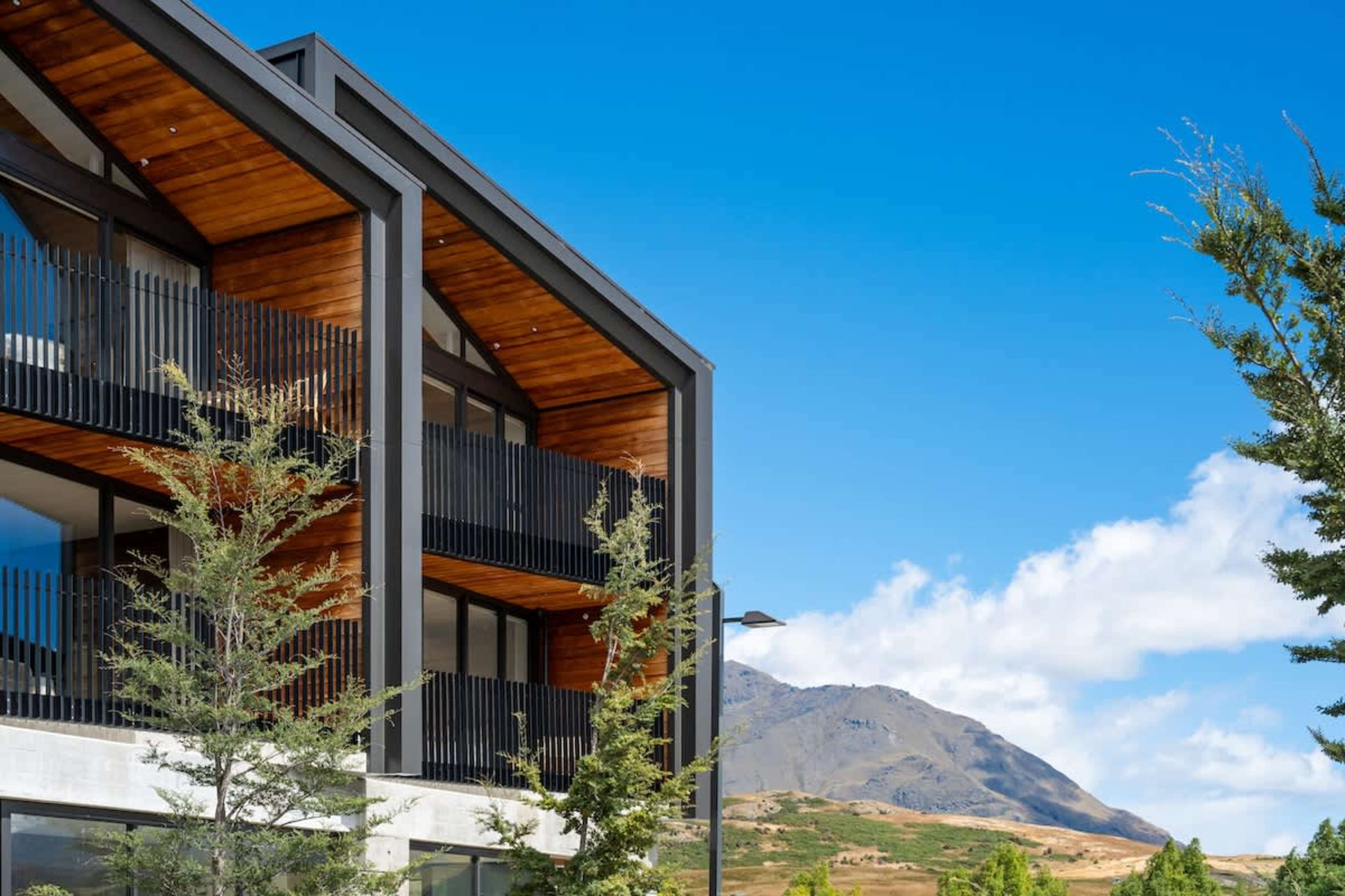 Stunning exterior, Clubhouse Lane apartments, Jacks Point Golf Course. Modern alpine architecture with panoramic views of The Remarkables mountains & Lake Tewa. Queenstown golf & skiing