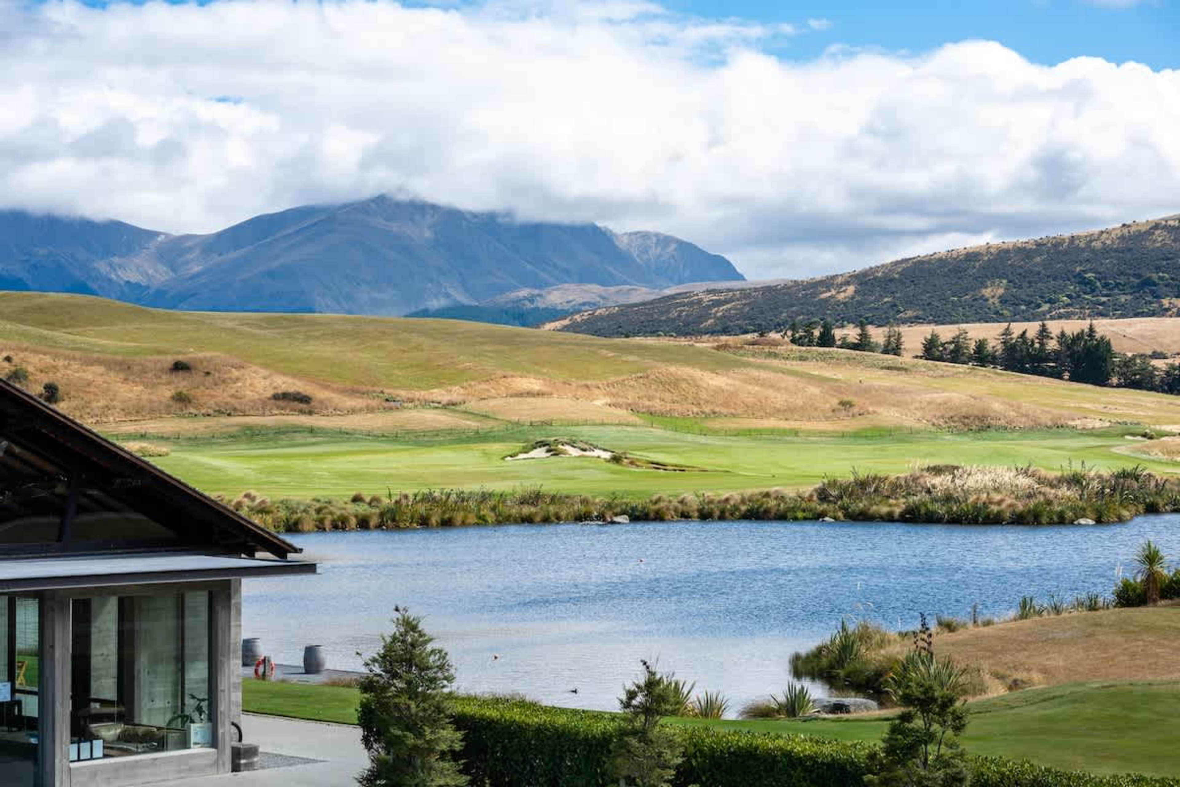 Beautiful Clubhouse Lane exterior, Jacks Point. Contemporary alpine architecture on the golf course, framed by The Remarkables mountains and Lake Tewa. Ideal Queenstown golf & skiing getaway.
