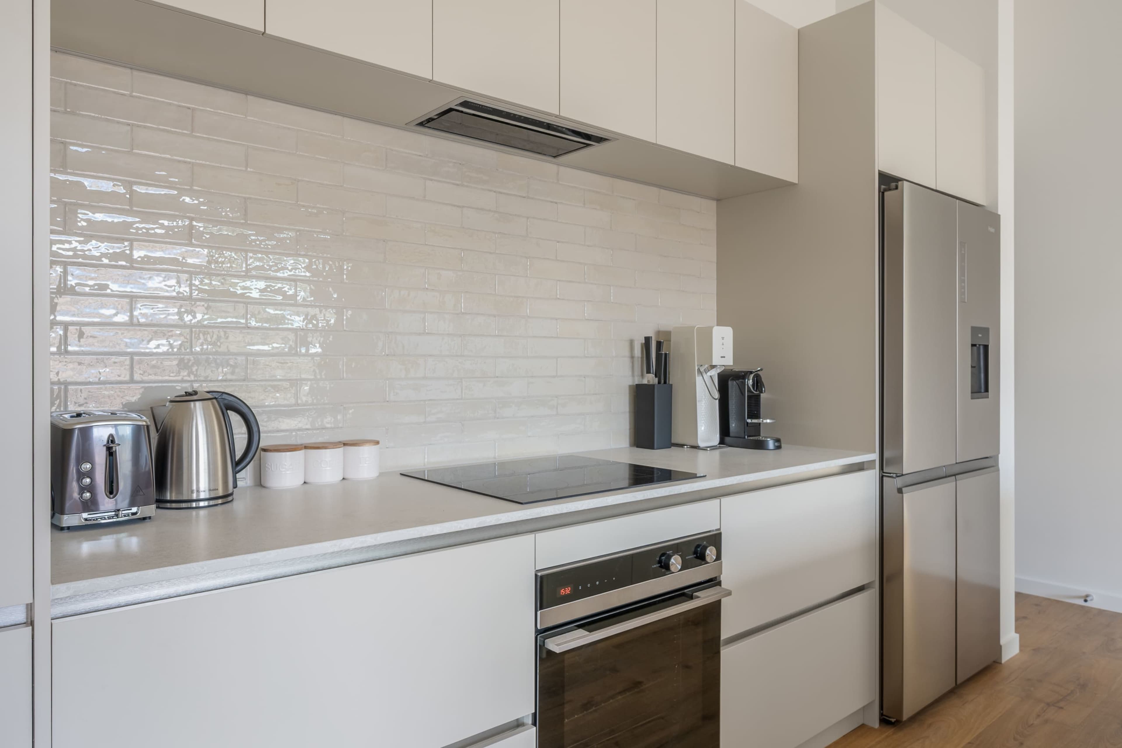 A sleek, fully equipped kitchen, complete with Nespresso machine and Soda Stream.
