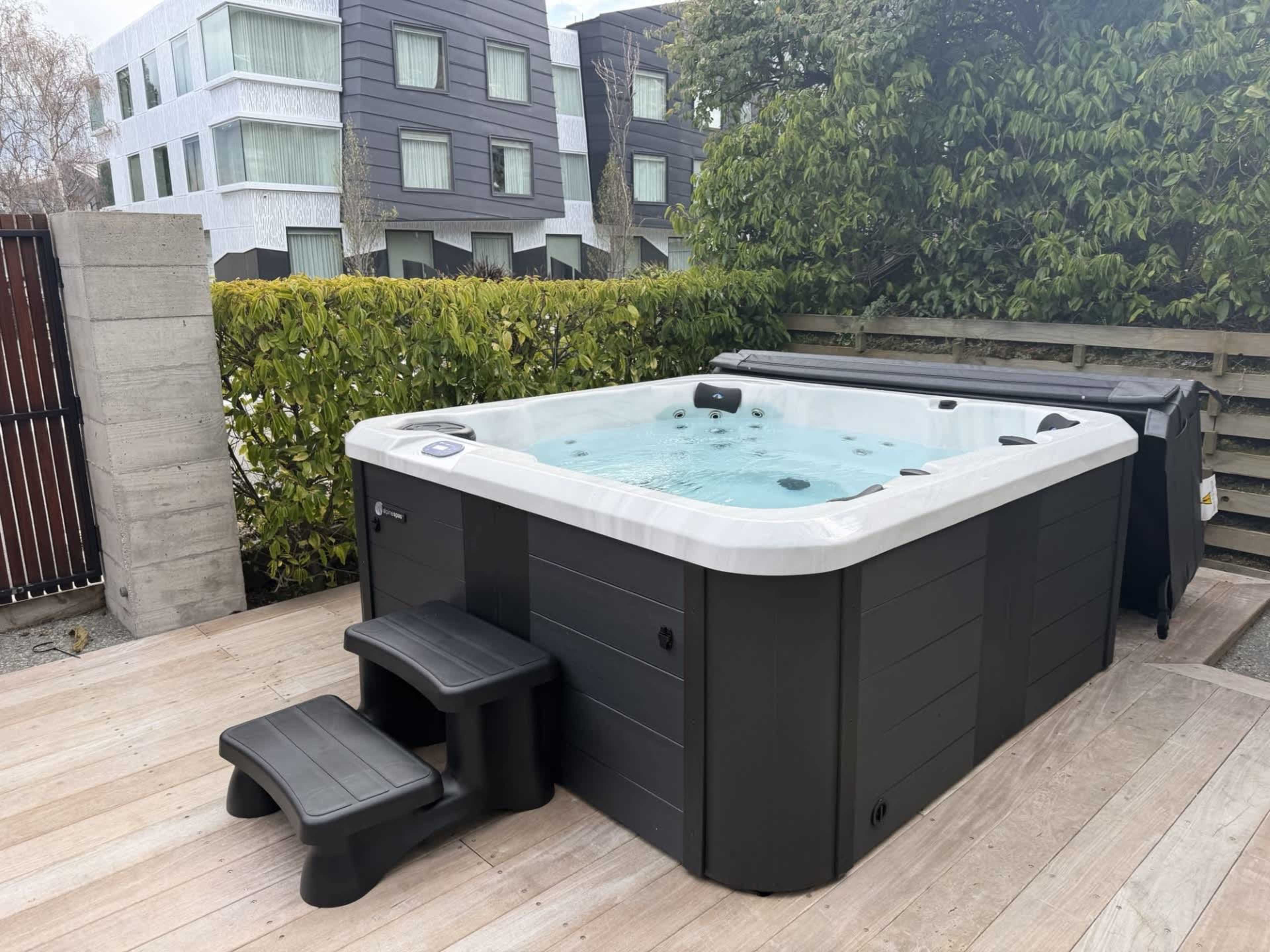 Enjoy a relaxing soak in the hot tub on your deck.