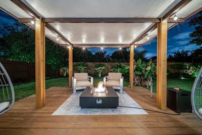 Cozy fireplace with two swing chairs