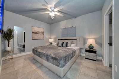 Second master bedroom, with 55' TV in suite bathroom