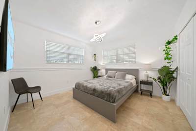 Fourth bedroom with queen size bed and smart tv