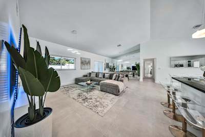 Spacious open-concept living room with bar stool seating