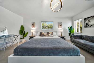 Plush bedding and comfortable seating in the spacious primary suite.