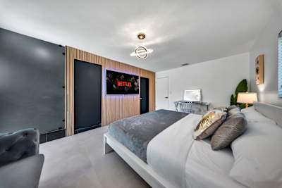 The ultimate master retreat featuring a premium Smart TV and a walk-in closet