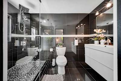 Private master ensuite bathroom with high-end fixtures and finishes.