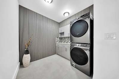 Dedicated laundry space with high-capacity appliances.