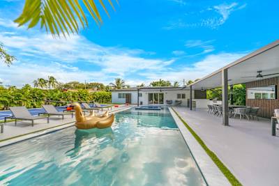 Poolside paradise with a golden swan float