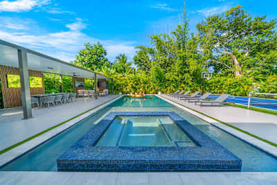 Private oasis with heated pool, hot tub, and poolside seating