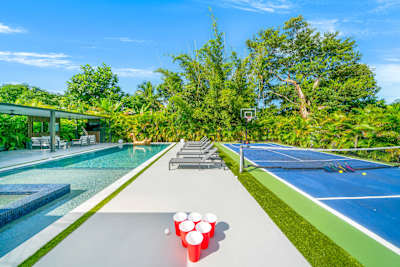 Backyard paradise with pool, hot tub, and games
