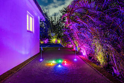 Practice your swing on the villa’s mini golf course.