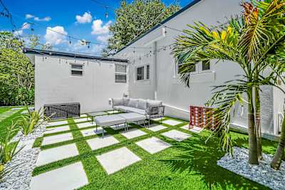 Private backyard with cozy fire pit lounge.