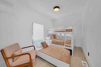 Perfect for larger groups, this thoughtfully designed bunk room offers comfortable sleeping arrangements while keeping everyone together.