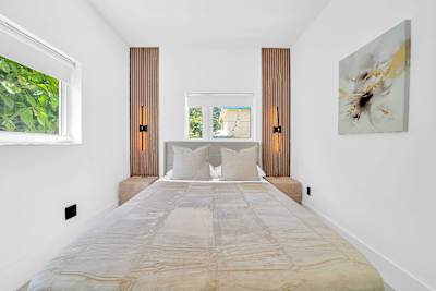 Unwind in a comfortable bedroom designed for a restful night's sleep after a day exploring Miami.