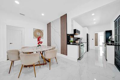 Cook, dine, and connect in this spacious open-concept kitchen and dining area.