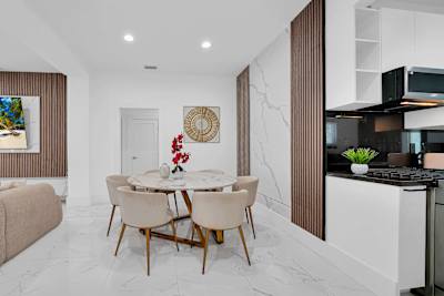 A fully equipped kitchen and spacious dining area make entertaining effortless.