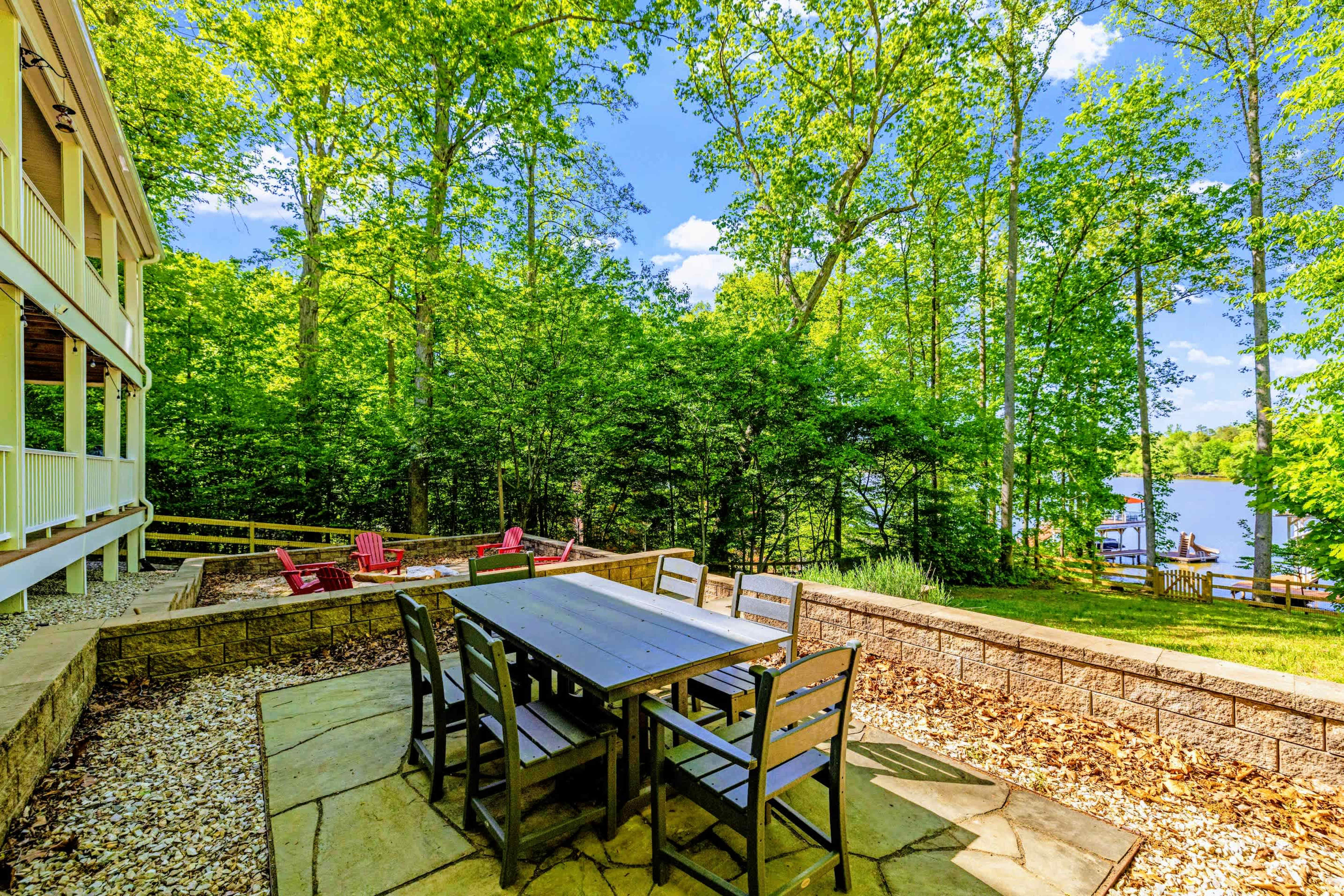 Patio - Outdoor dining and Adirondak chairs around the fire invite you to settle in for the evening.
