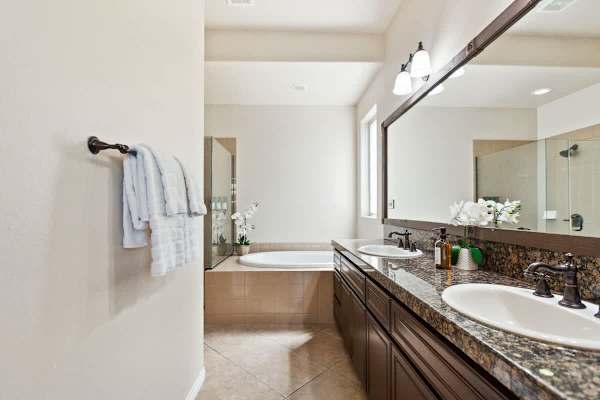 Fresh towels and a clean spa-like bathroom make mornings feel special.