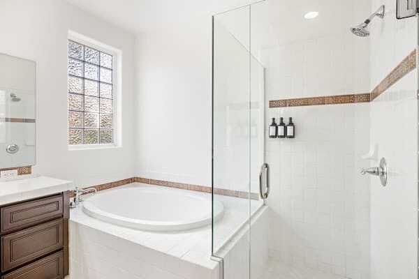 Deep soaking tub invites you to relax with a glass of wine after exploring.