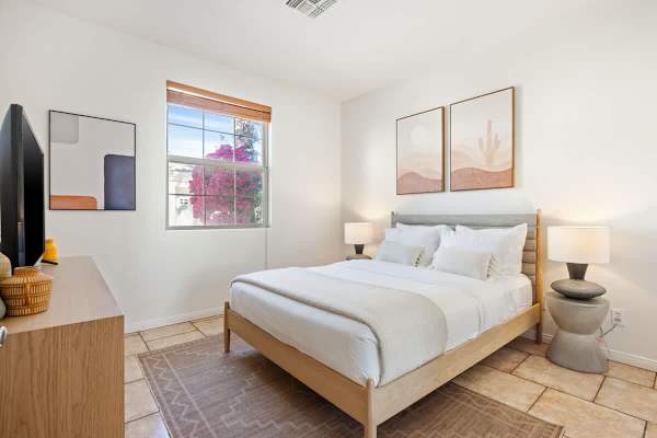 Second bedroom offers a quiet haven with comfortable queen bed for guests.
