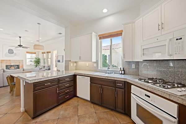 Granite counters and full-size appliances make cooking feel like a breeze here.