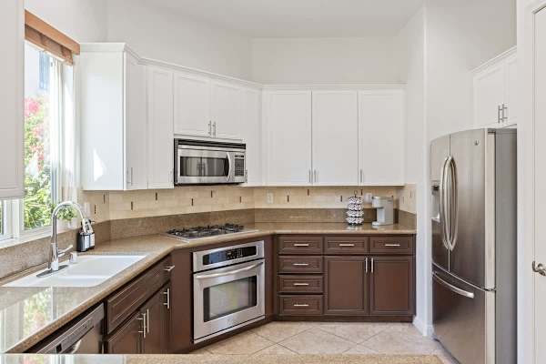 White cabinets and stainless appliances give you a clean workspace for meal prep.