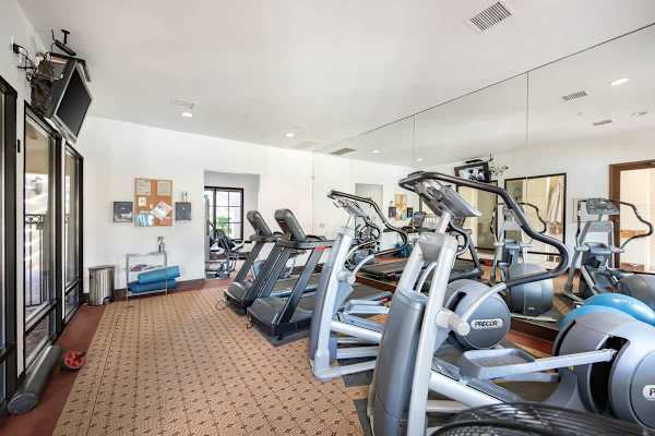 Full gym with cardio and strength equipment helps you maintain your workout goals.