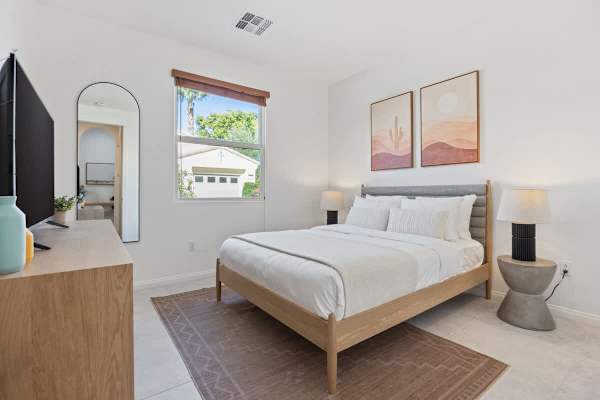 Guest bedroom with queen bed provides a private escape for friends or family.