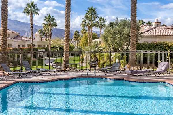 Crystal clear water and mountain backdrop make every swim feel like a vacation dream.