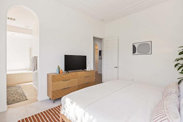 Minimalist design and warm wood tones create a tranquil retreat for rest.