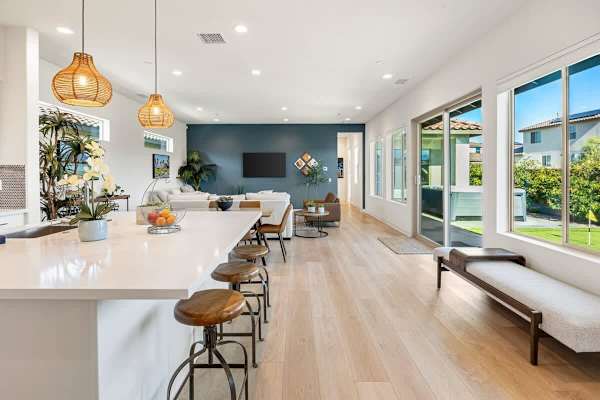 Kitchen opens to dining and living—sight lines keep everyone connected during meal prep.