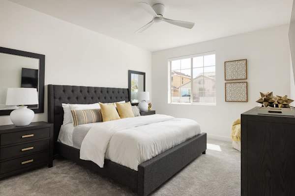 Primary bedroom blends elegance with cheerful desert energy.