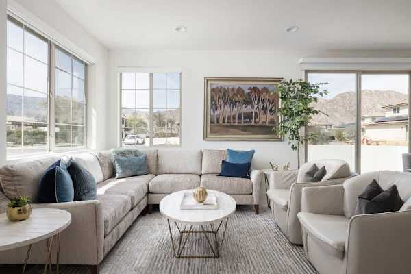 Neutral tones and navy accents create calm sophistication.