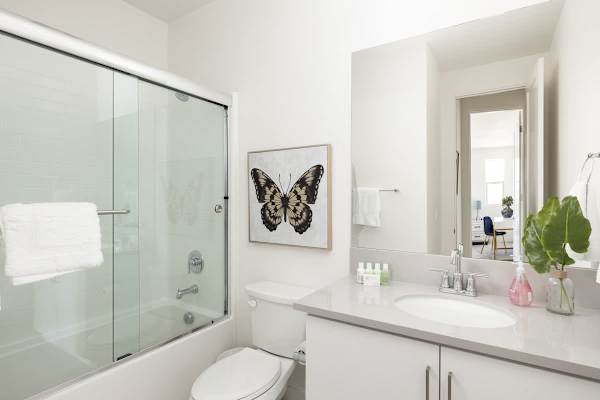 Glass shower and tub combo serve guests beautifully.