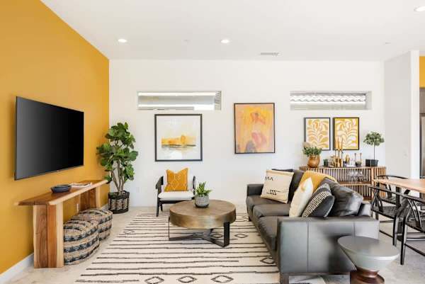 Living room with beautiful yellow accents to brighten your day.