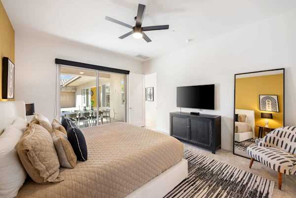 Master Suite 1 has a king-size bed and a TV.